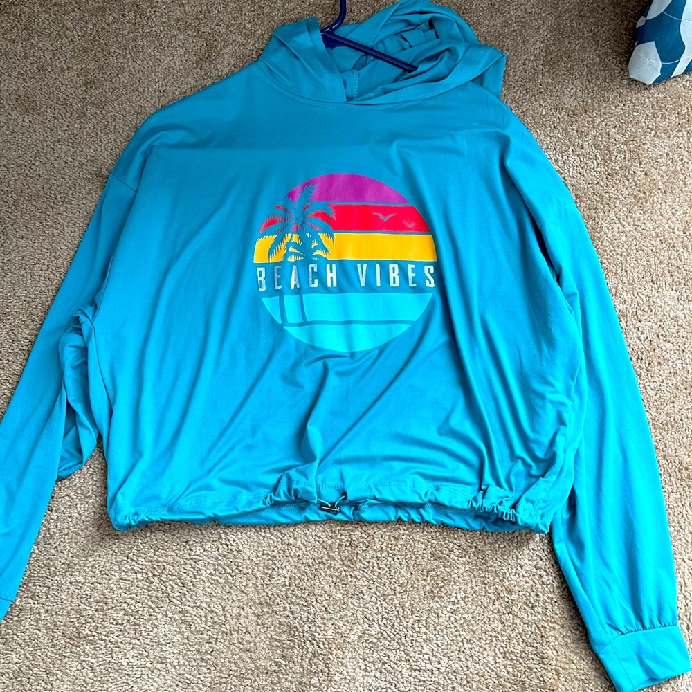 Crop pullover sweatshirt, teal in color, UK2LA size small